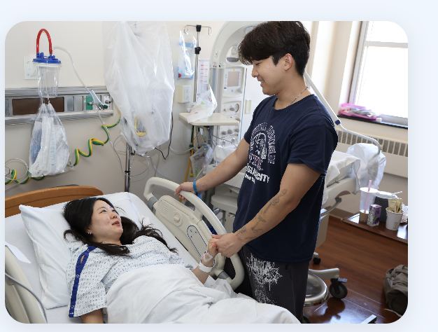 Partner supporting patient in labor and delivery room