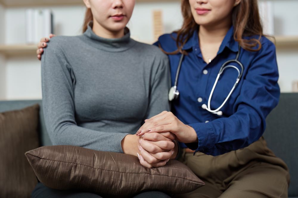 OB/GYN physician consulting with a patient