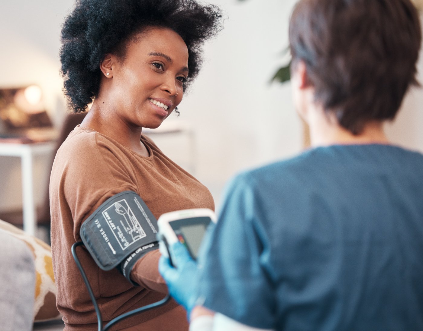 Nurse checking a patient's blood pressure
