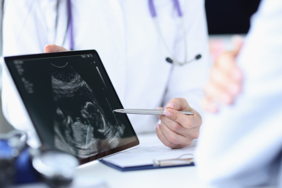 Physician reviewing a fetal ultrasound