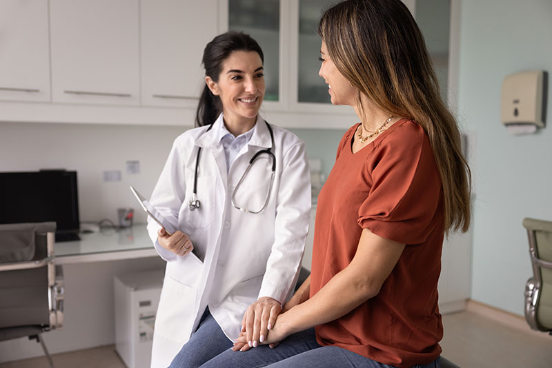 Physician consulting with a patient in an exam room