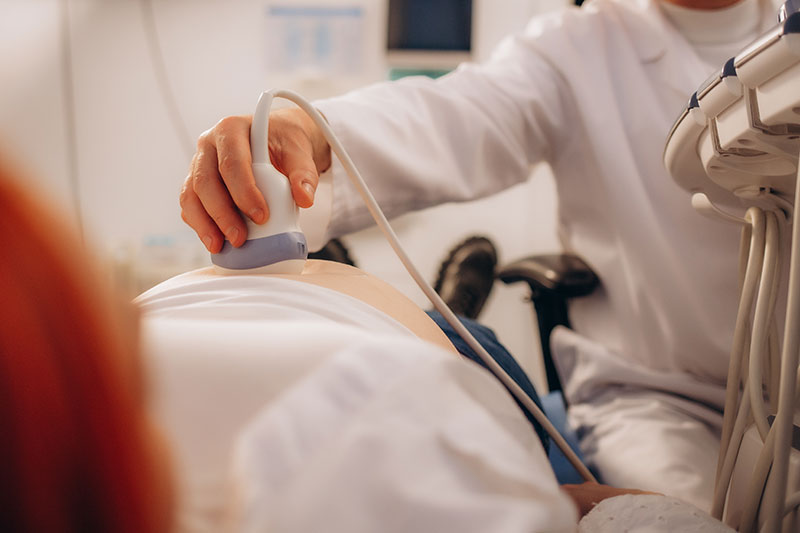 Physician performing an ultrasound exam