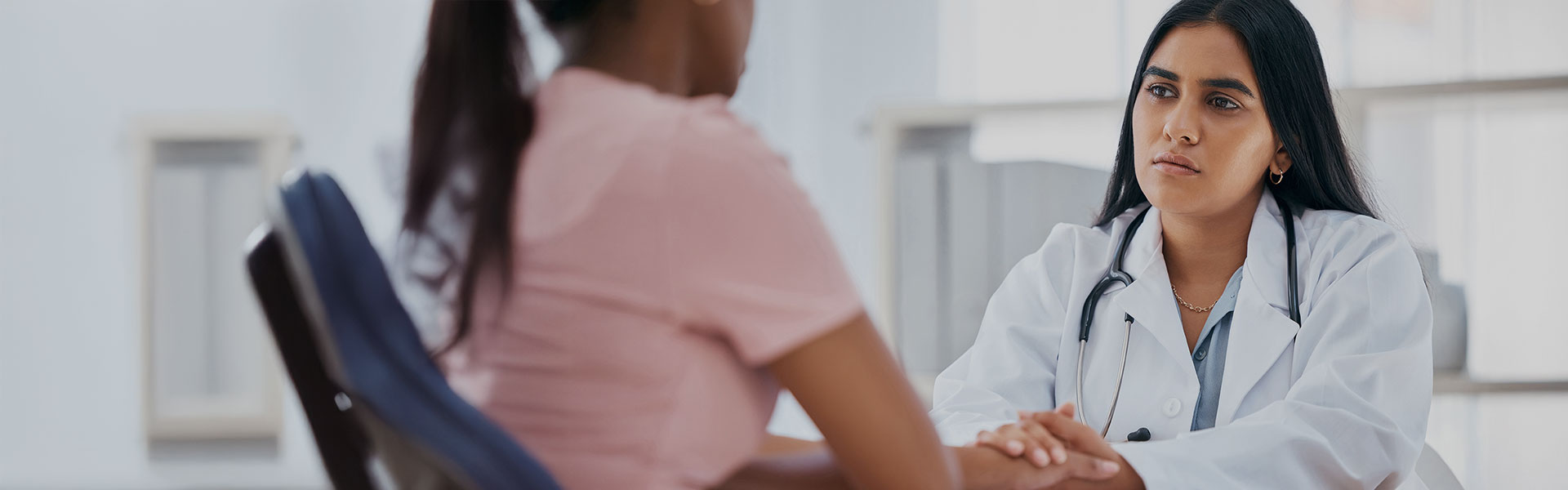 Physician listening closely to a patient