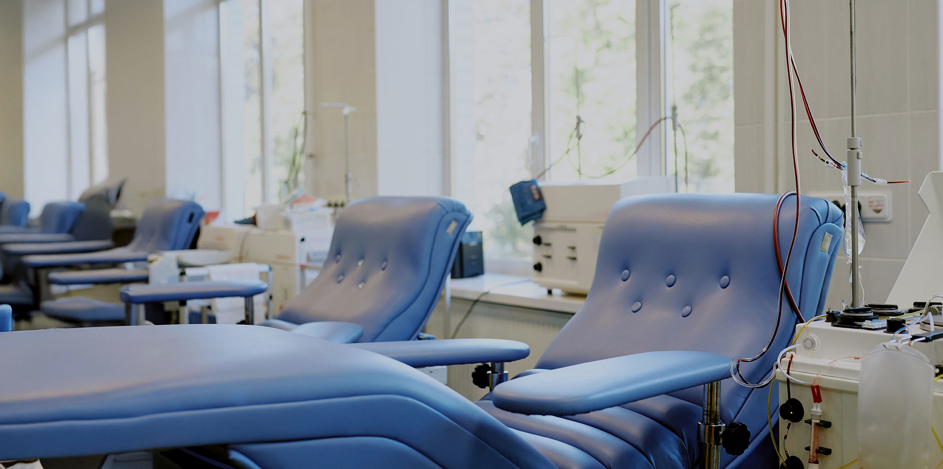 Infusion treatment chairs in a bright, modern suite